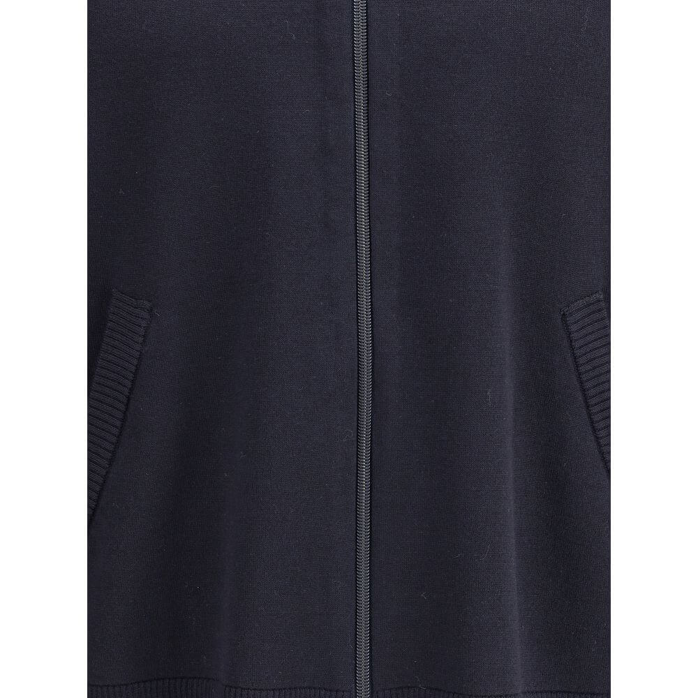 Close-up of Thom Browne Blue Fleece Wool Cardigan featuring the front zipper and side welt pockets, showcasing ribbed details.