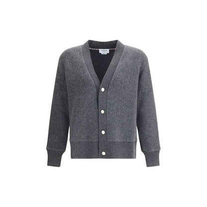 Thom Browne Gray Wool Cardigan with v-neck, button closure, and ribbed cuffs and hem. 100% wool, ideal for a sophisticated touch to your wardrobe.