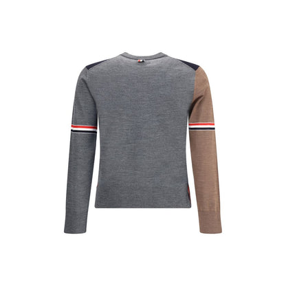Back view of Thom Browne Multicolor Fleece Wool Sweatshirt featuring tricolor banded sleeves on grey and brown fabric.