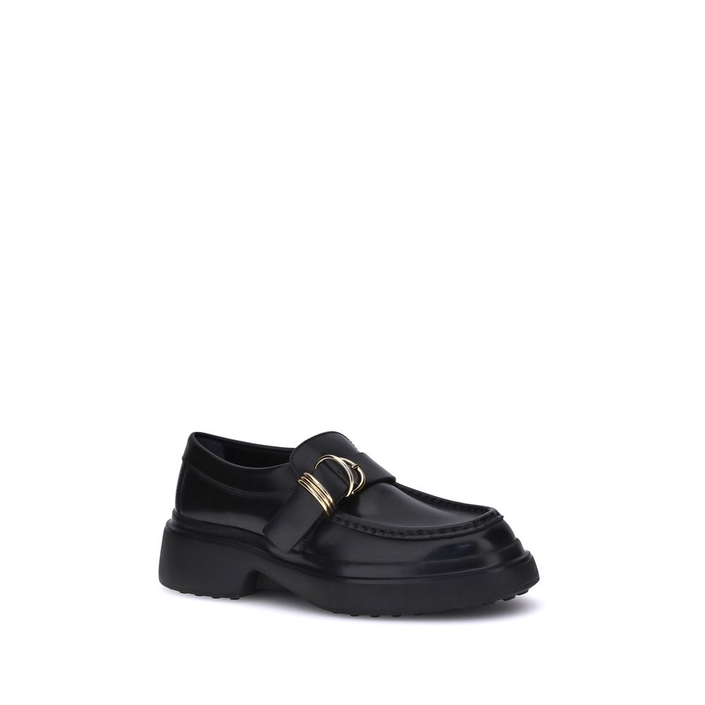 Tod's Black Rubber Platform Loafers with metal rings and nappa leather for a timeless and elegant style.