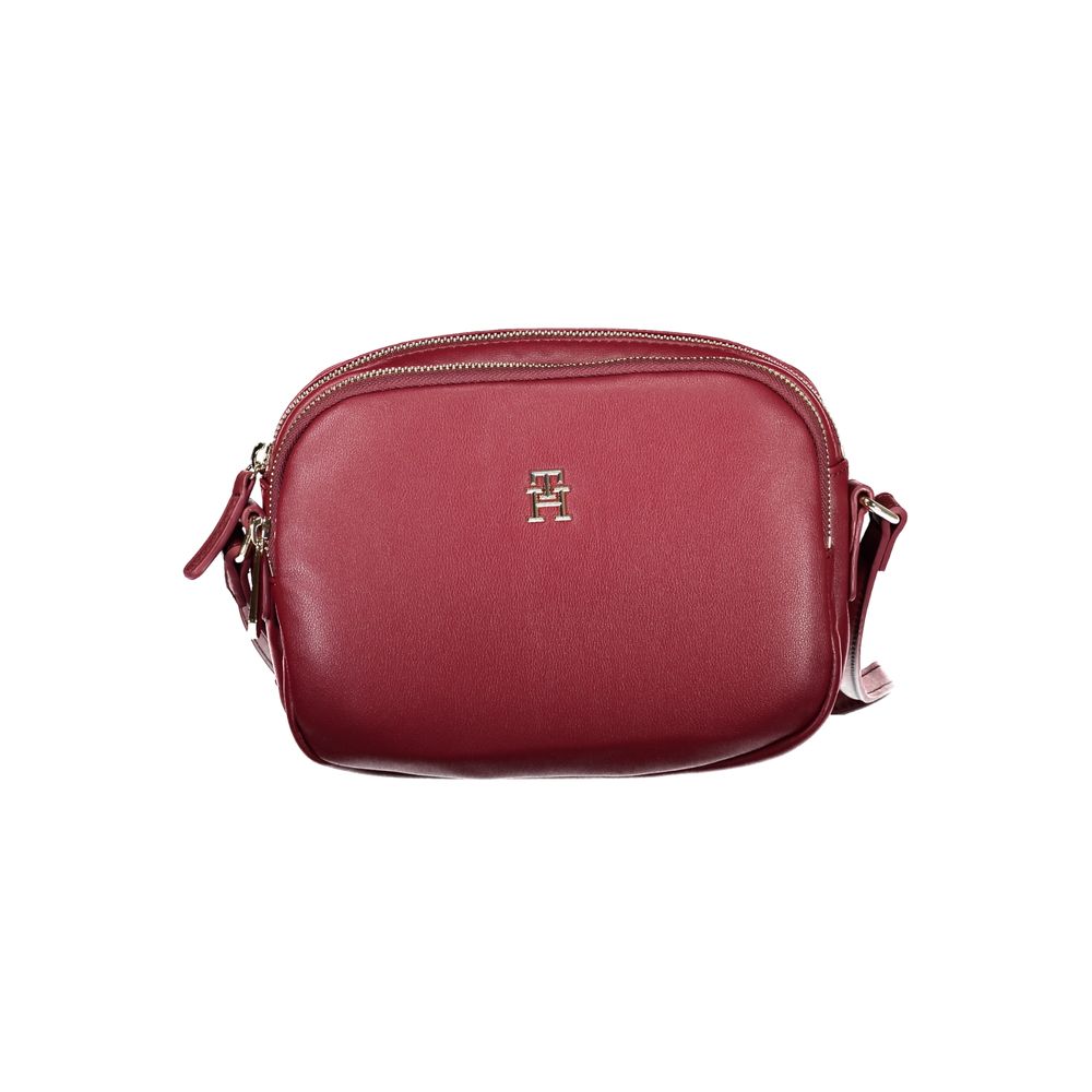 Tommy Hilfiger Red Polyester Handbag with adjustable shoulder strap, two compartments, internal pocket, and zip closure