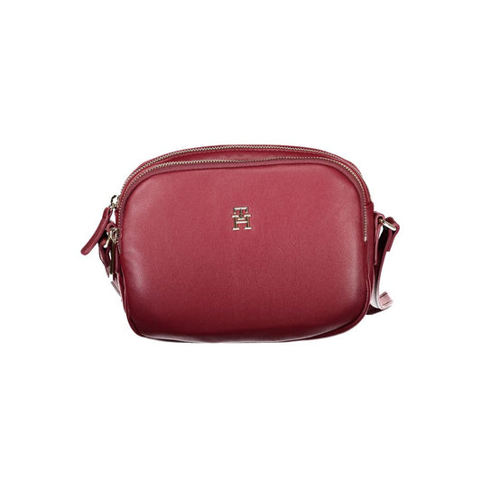 Tommy Hilfiger Red Polyester Handbag with adjustable shoulder strap, two compartments, internal pocket, and zip closure