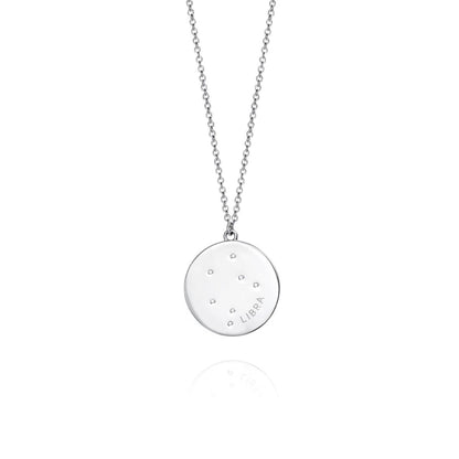 Silver Libra constellation necklace with round pendant and delicate chain, showcasing zodiac design in a minimalist style.