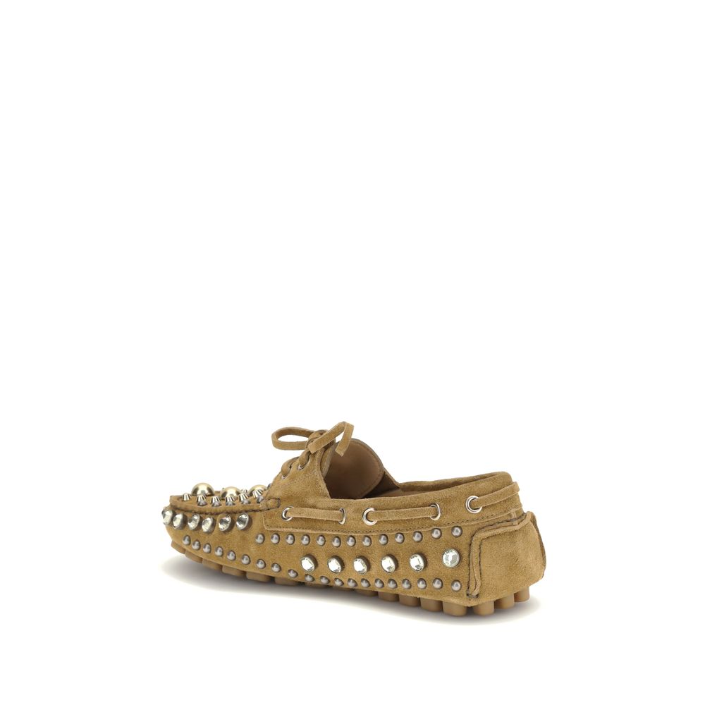 Valentino Garavani Beige Calf Leather Bos Taurus Slip-On Loafers with rhinestones and studs, side view showcasing detail and texture.