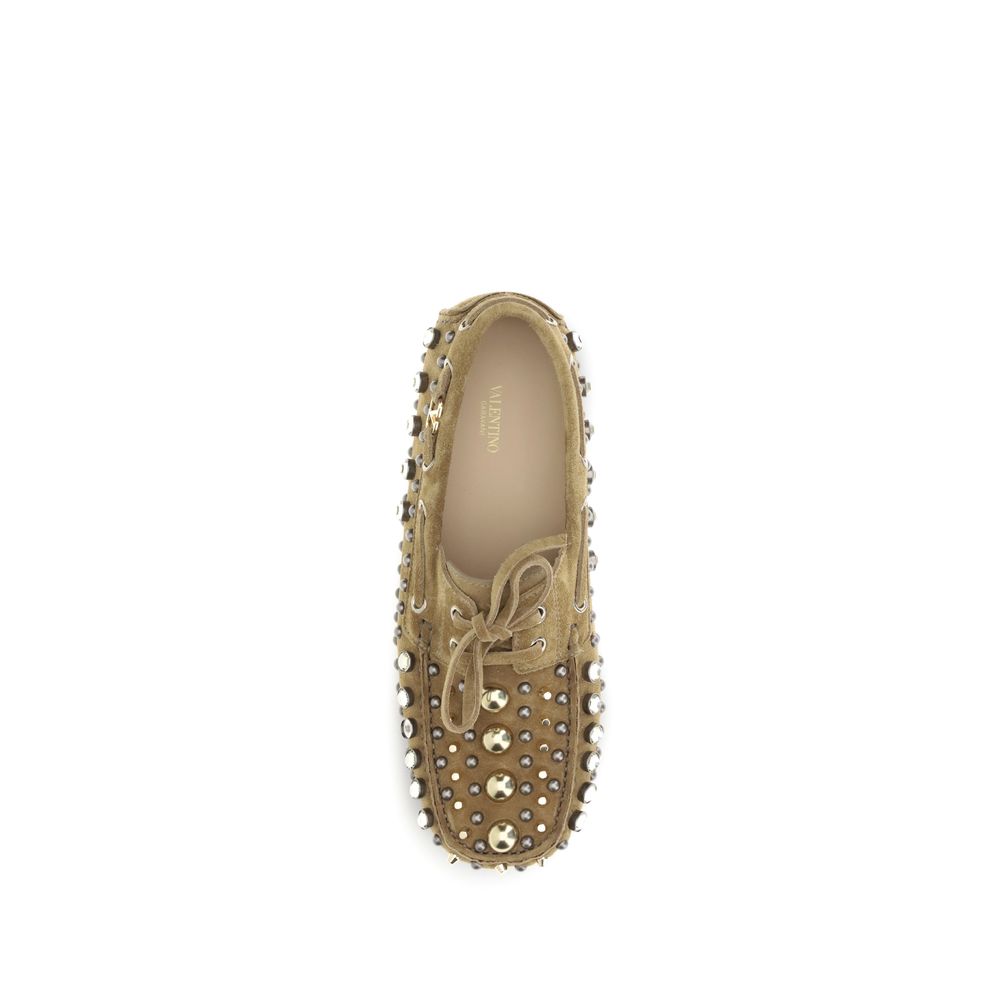 Valentino Garavani Beige Calf Leather Bos Taurus Slip-On Loafers with studs and rhinestones, top view of stylish and sophisticated design.