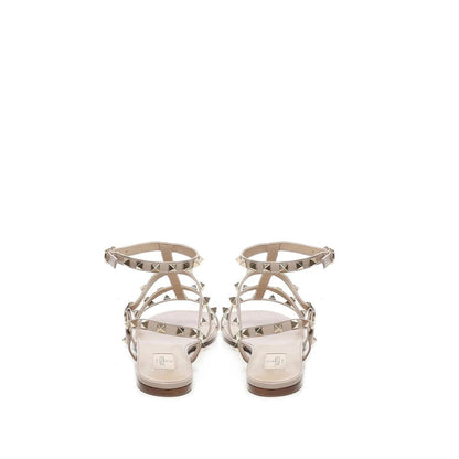 Valentino Garavani Beige Calfskin Sandals with gold-tone rockstuds and ankle buckle fastening, rear view.