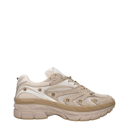 Valentino Garavani Beige Fabric Low Top Sneakers with front and back logos, studs, and lace-up closure.