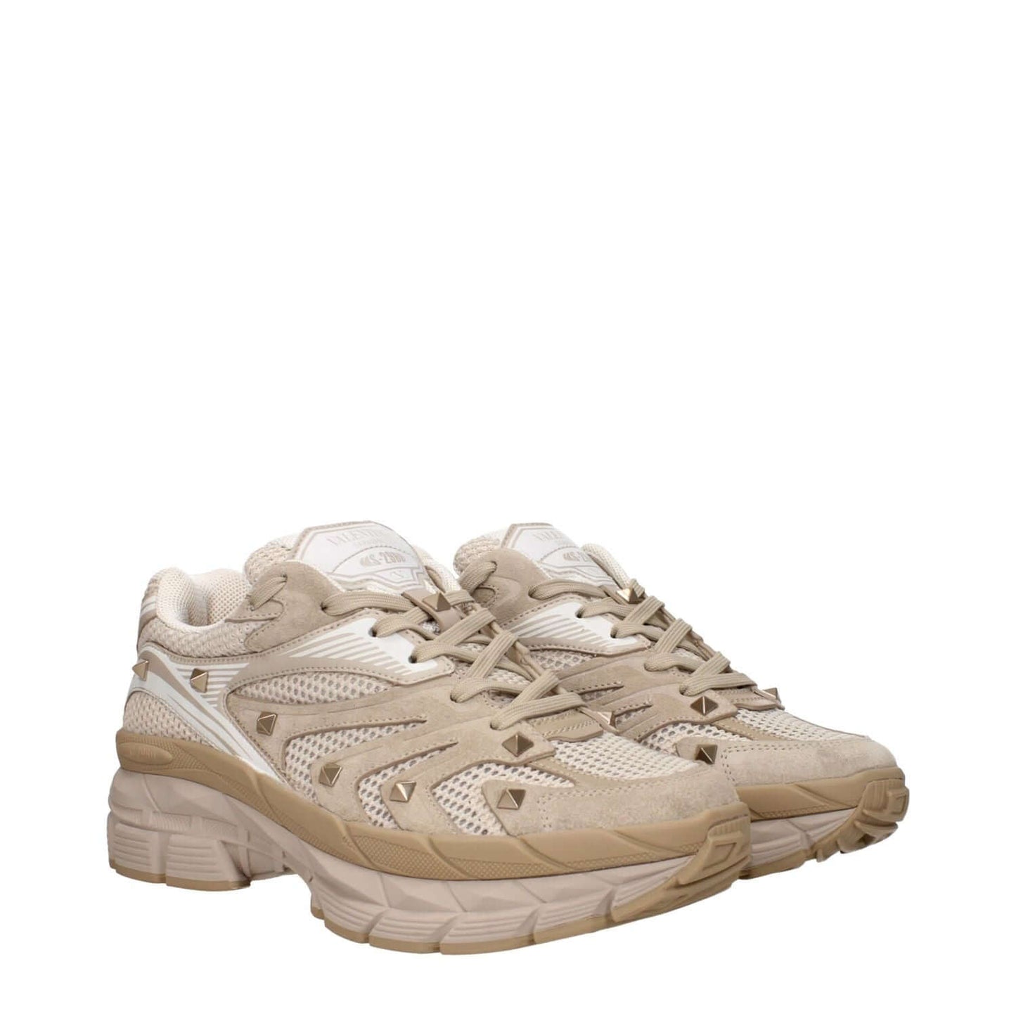 Valentino Garavani Beige Fabric Low Top Sneakers with lace-up closure, round toe, mid heels, rubber sole, front and back logos, and studs.