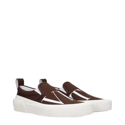 Valentino Garavani Brown Fabric Slip-On Loafers with white rubber soles and logo design, featuring a round toe and casual style.