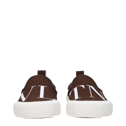 Valentino Garavani Brown Fabric Slip-On Loafers with front and back logos, rubber sole, and round toe design.