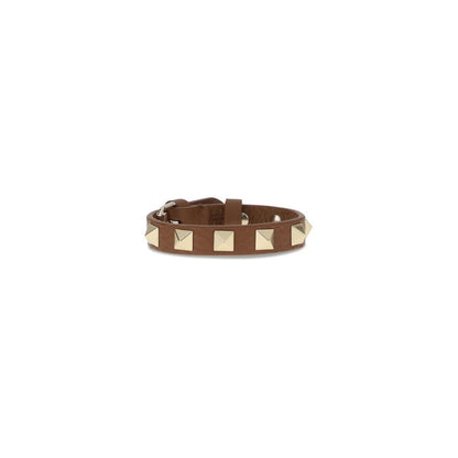 Valentino Garavani Brown Metal Bracelet with iconic rockstuds and adjustable buckle closure showcasing luxury craftsmanship.