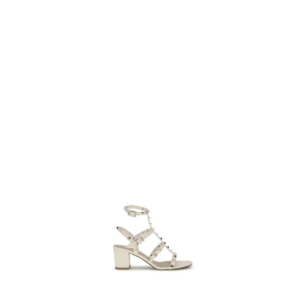 Valentino Garavani Cream Calf Leather Bos Taurus Sandals with Rockstud accents and chunky heel.