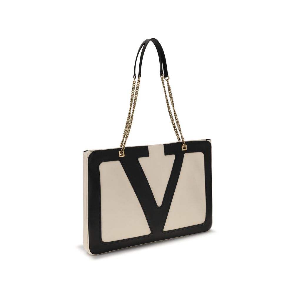 Valentino Garavani Cream Lamb Ovis Aries Aries Shoulder Bag with signature maxi VLogo and chain strap in cream and black.
