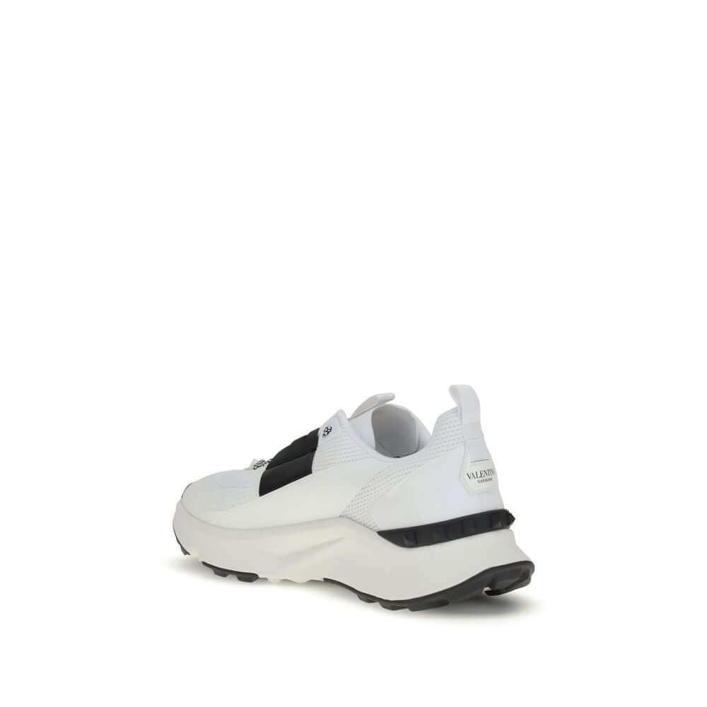 Valentino Garavani White Calf Leather Bos Taurus Athletic Sneakers with studded custom rubber sole, view of heel and side logo.