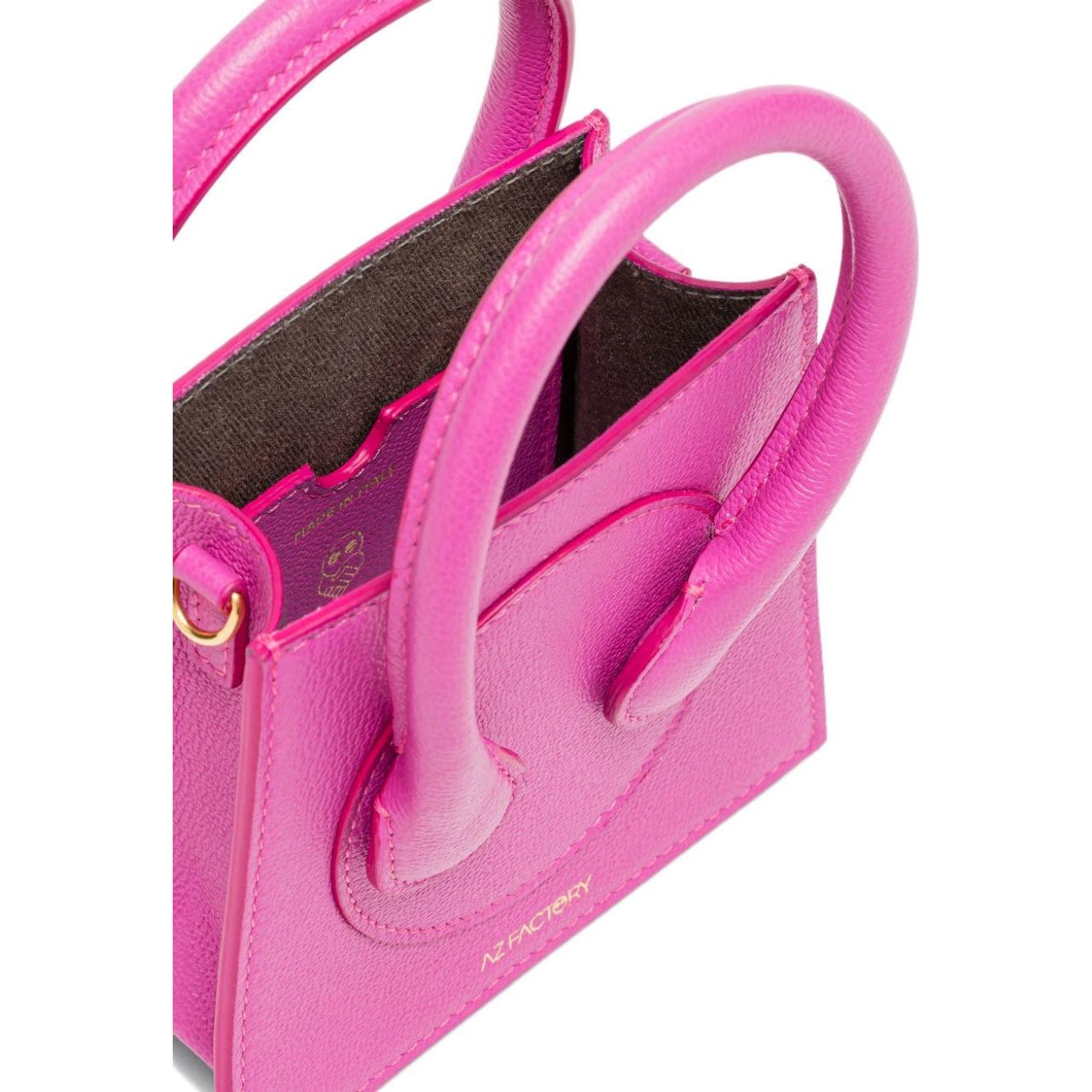 Front view with bag zipped and handles upright.
